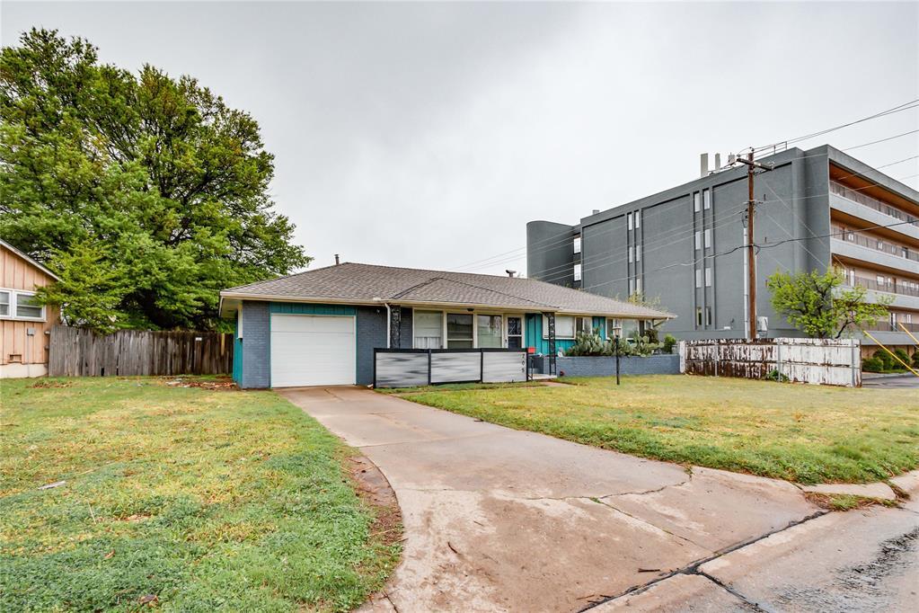 205 E Morningside Dr, Midwest City, OK 73110 - view of front of property featuring a garage and driveway