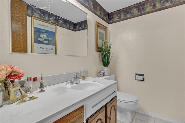 6706 N Woodward Dr, Oklahoma City, OK 73116 - bathroom with tile patterned flooring, vanity, and toilet