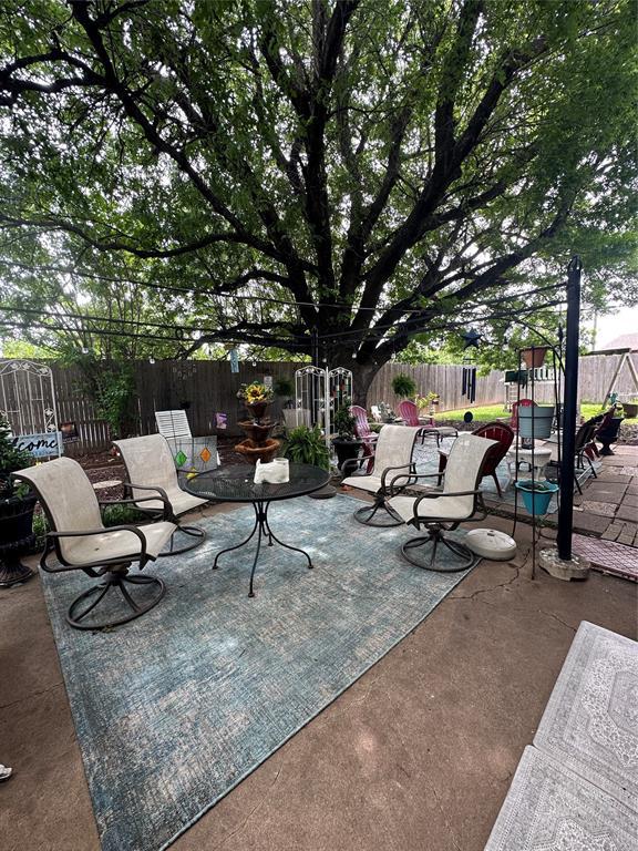 6706 N Woodward Dr, Oklahoma City, OK 73116 - view of patio with a fenced backyard and outdoor dining space