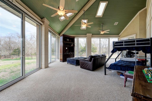 815 River View Dr, Norman, OK 73071 - bedroom featuring carpet flooring, access to exterior, high vaulted ceiling, and a skylight