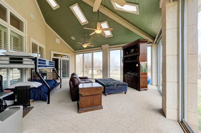 815 River View Dr, Norman, OK 73071 - bedroom with carpet floors, high vaulted ceiling, multiple windows, and a skylight