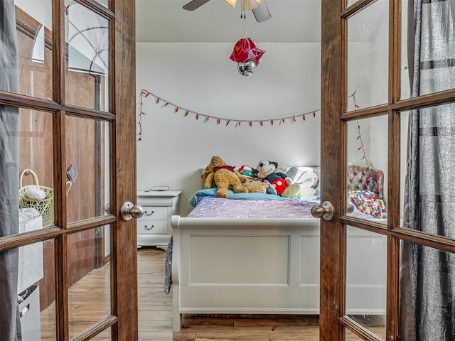 bedroom featuring wood finished floors and ceiling fan