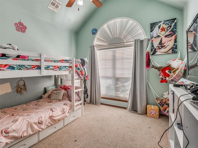 carpeted bedroom with visible vents, ceiling fan, and lofted ceiling