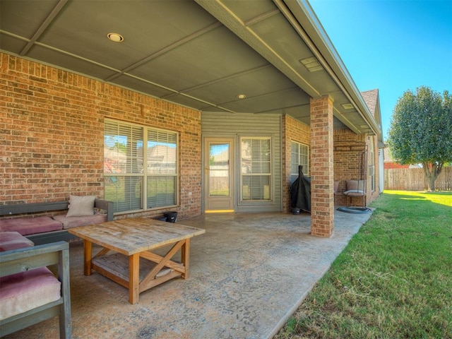view of patio / terrace featuring fence and a grill