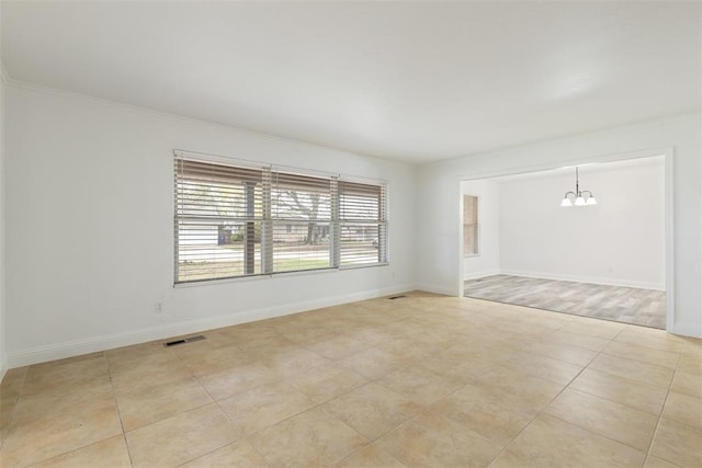 6200 N Styll Rd, Oklahoma City, OK 73112 - unfurnished room with a chandelier, baseboards, and light tile patterned floors
