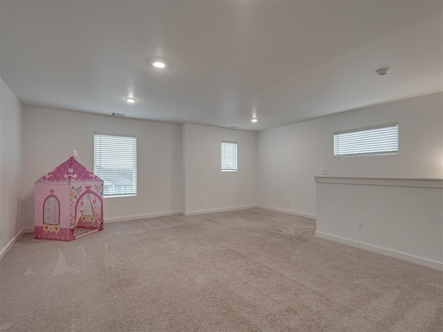 rec room with light colored carpet, baseboards, visible vents, and recessed lighting