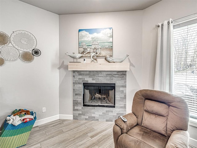 21608 SE 95th St, Mcloud, OK 74851 - living room with wood finished floors, plenty of natural light, a tile fireplace, and baseboards