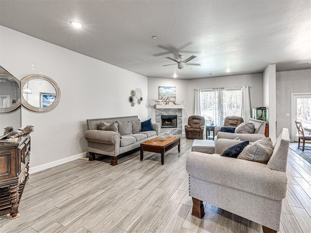 21608 SE 95th St, Mcloud, OK 74851 - living room featuring a ceiling fan, light wood finished floors, baseboards, a stone fireplace, and recessed lighting