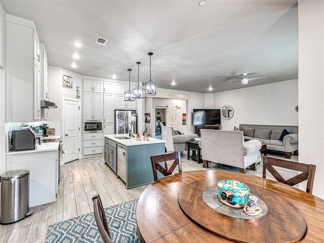 21608 SE 95th St, Mcloud, OK 74851 - dining room featuring a ceiling fan, light wood-style floors, and recessed lighting