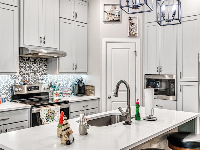 21608 SE 95th St, Mcloud, OK 74851 - kitchen featuring stainless steel electric range, under cabinet range hood, built in microwave, a sink, and light stone counters