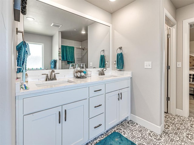 21608 SE 95th St, Mcloud, OK 74851 - bathroom with double vanity, a shower stall, tile patterned floors, and baseboards