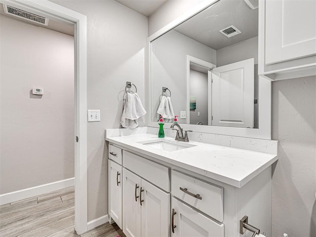 21608 SE 95th St, Mcloud, OK 74851 - bathroom featuring vanity, wood finished floors, and baseboards