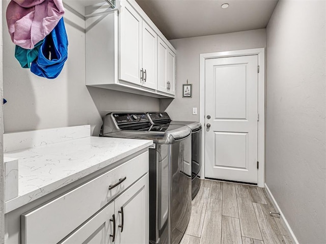 21608 SE 95th St, Mcloud, OK 74851 - laundry room with washing machine and dryer, cabinet space, light wood finished floors, and baseboards