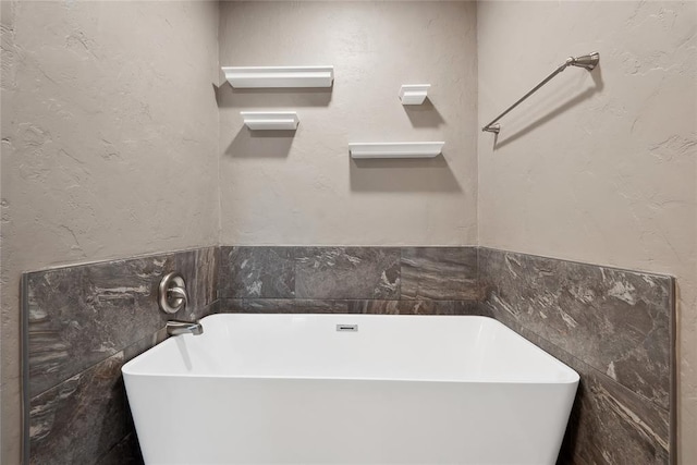 full bathroom featuring a freestanding tub