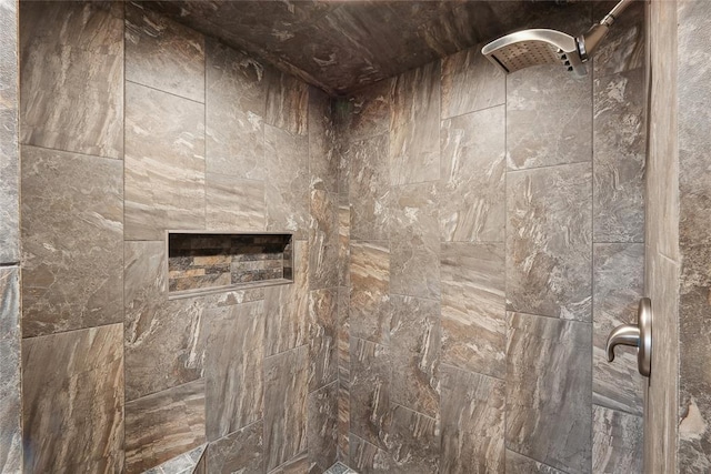 bathroom with a tile shower
