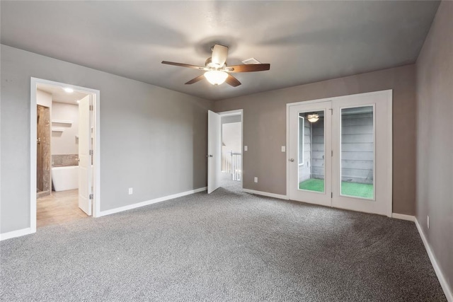 unfurnished bedroom with ensuite bath, ceiling fan, carpet floors, and baseboards
