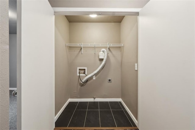 laundry room featuring laundry area, hookup for an electric dryer, baseboards, dark tile patterned flooring, and washer hookup