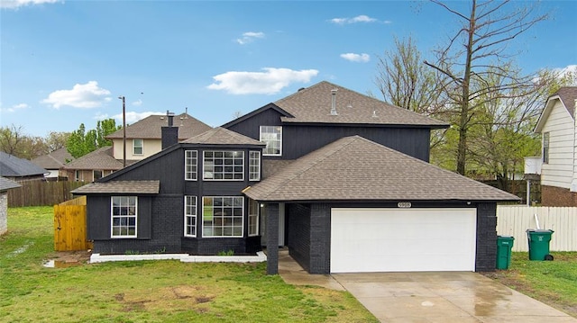 traditional-style house with an attached garage, roof with shingles, fence, and a front yard
