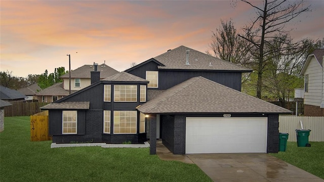 view of front of property with a garage, roof with shingles, and fence