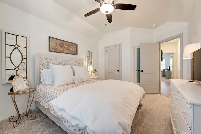 bedroom featuring light carpet, vaulted ceiling, and ceiling fan