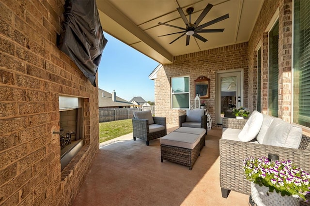 view of patio / terrace with fence, an outdoor hangout area, and ceiling fan