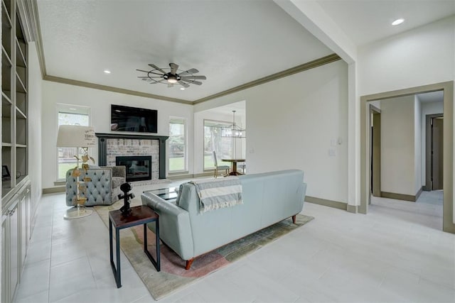 living room featuring baseboards, crown molding, recessed lighting, and a brick fireplace