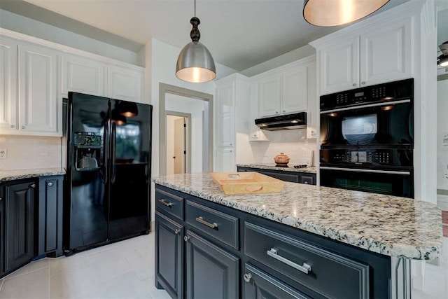kitchen with white cabinetry, decorative light fixtures, under cabinet range hood, decorative backsplash, and black appliances