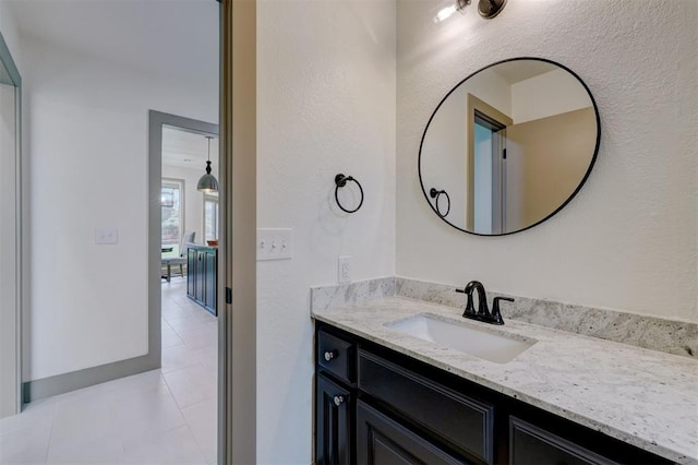 bathroom featuring tile patterned flooring and vanity