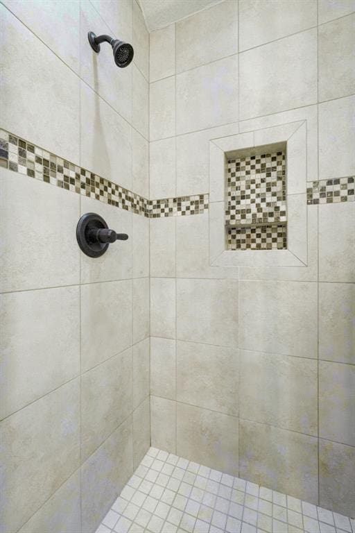 full bath featuring tiled shower