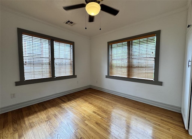 2252 NW 37th St, Oklahoma City, OK 73112 - spare room featuring light wood-type flooring, a ceiling fan, and crown molding