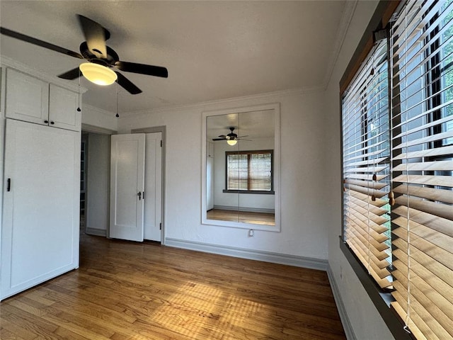 2252 NW 37th St, Oklahoma City, OK 73112 - unfurnished bedroom featuring wood finished floors, ornamental molding, and ceiling fan