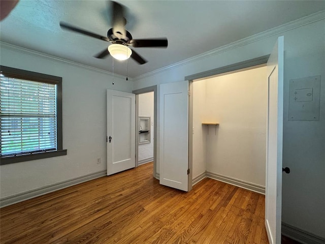 2252 NW 37th St, Oklahoma City, OK 73112 - unfurnished bedroom with wood finished floors, ornamental molding, a ceiling fan, and a closet