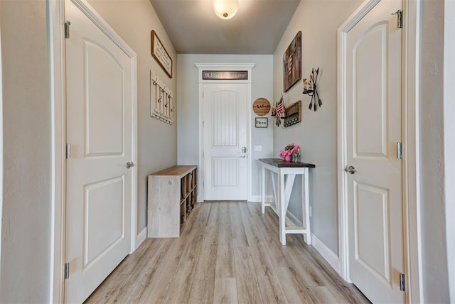 31352 Landrun Ave, Norman, OK 73072 - doorway to outside with light wood-style flooring and baseboards