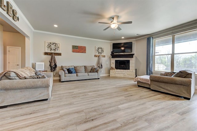 31352 Landrun Ave, Norman, OK 73072 - living room with ceiling fan, crown molding, a fireplace, wood finished floors, and recessed lighting