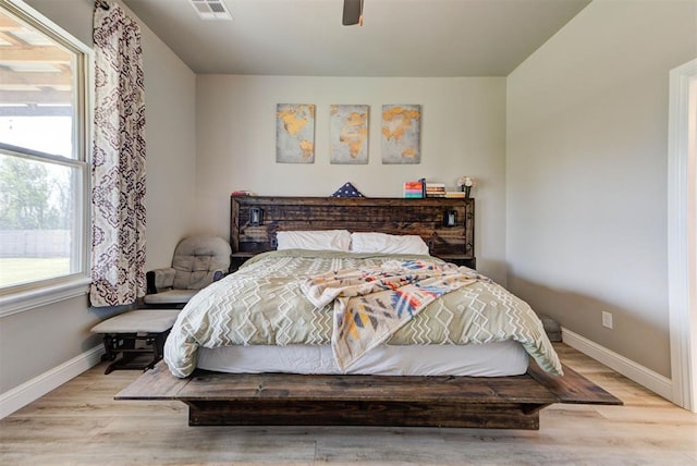 31352 Landrun Ave, Norman, OK 73072 - bedroom featuring baseboards, wood finished floors, and a ceiling fan