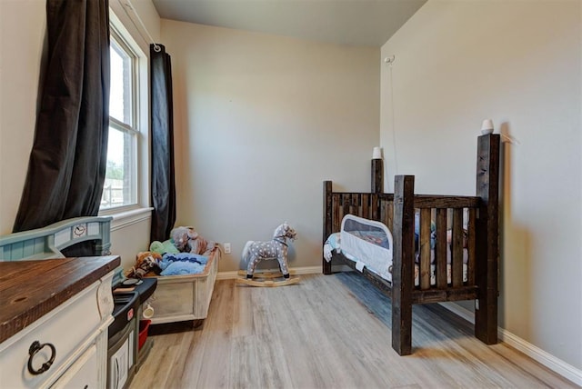 31352 Landrun Ave, Norman, OK 73072 - bedroom featuring light wood finished floors and baseboards
