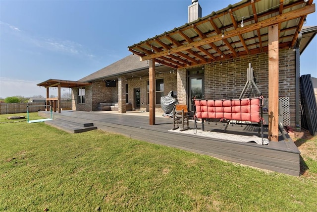 31352 Landrun Ave, Norman, OK 73072 - rear view of house featuring brick siding, a wooden deck, and a chimney