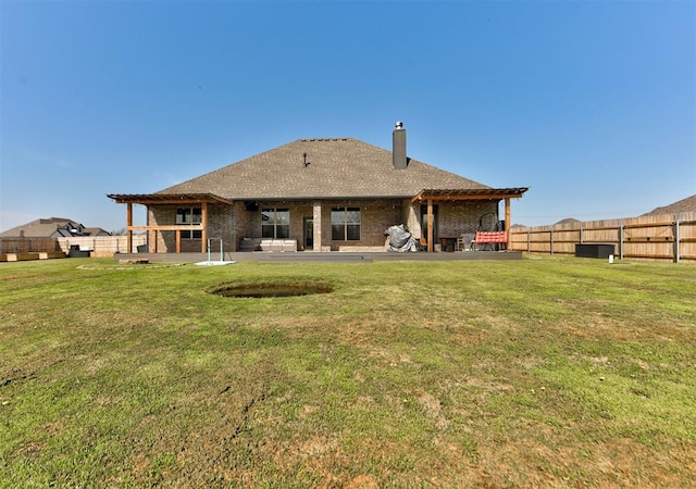 31352 Landrun Ave, Norman, OK 73072 - rear view of property featuring a chimney and a patio