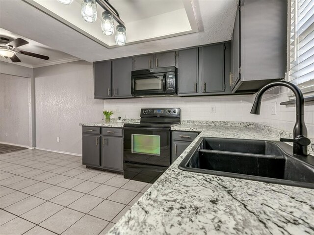 8131 NW 23rd St, Oklahoma City, OK 73127 - kitchen with baseboards, a sink, ceiling fan, black appliances, and gray cabinetry