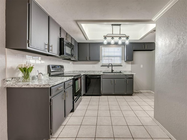 8131 NW 23rd St, Oklahoma City, OK 73127 - kitchen with a sink, a textured wall, a tray ceiling, black appliances, and decorative backsplash