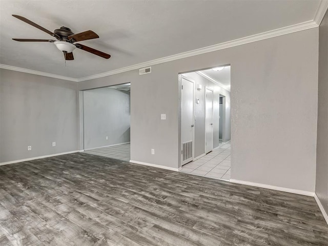 8131 NW 23rd St, Oklahoma City, OK 73127 - unfurnished room featuring visible vents, ceiling fan, and wood finished floors