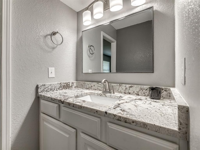 8131 NW 23rd St, Oklahoma City, OK 73127 - bathroom with a textured wall and vanity
