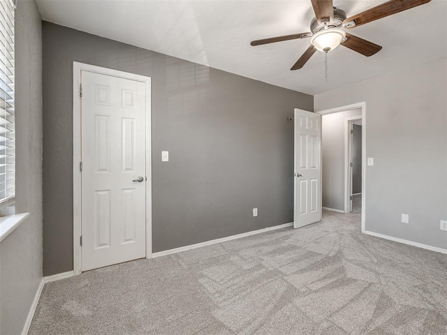 8131 NW 23rd St, Oklahoma City, OK 73127 - unfurnished bedroom featuring light carpet, baseboards, and a ceiling fan