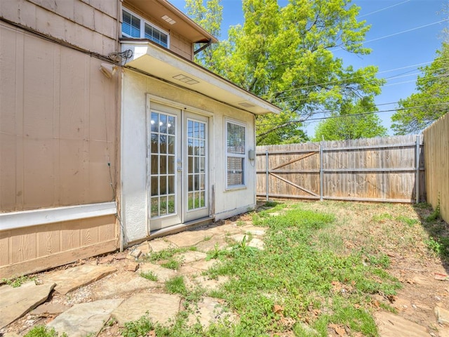 8131 NW 23rd St, Oklahoma City, OK 73127 - exterior space featuring a fenced backyard and french doors