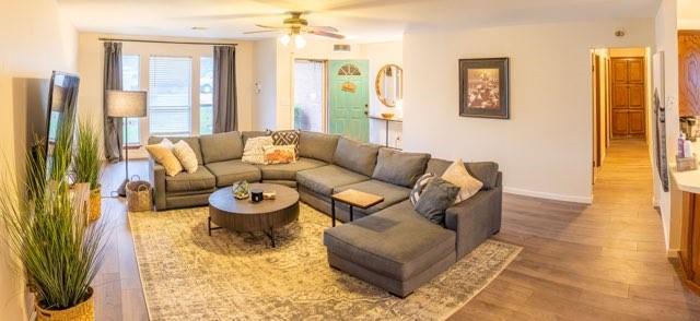 1189 N Blue Ridge Dr, Purcell, OK 73080 - living room featuring baseboards, a ceiling fan, and wood finished floors