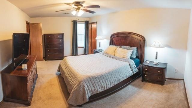1189 N Blue Ridge Dr, Purcell, OK 73080 - bedroom featuring ceiling fan and light carpet