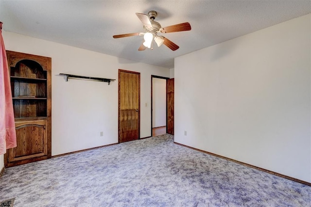 1809 W Aqua Clear Dr, Mustang, OK 73064 - interior space with visible vents, baseboards, carpet, and a textured ceiling