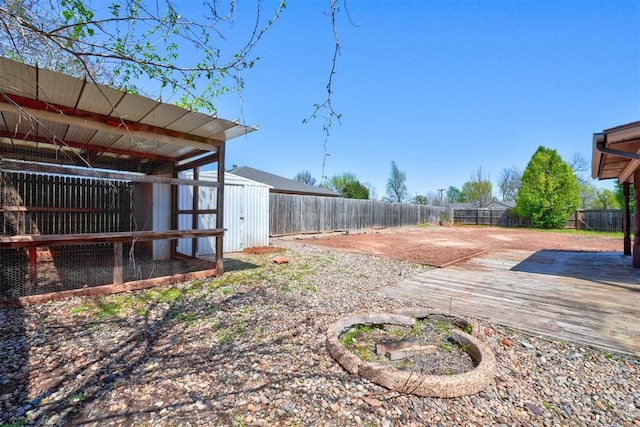 1809 W Aqua Clear Dr, Mustang, OK 73064 - view of yard with a fenced backyard and an outdoor structure