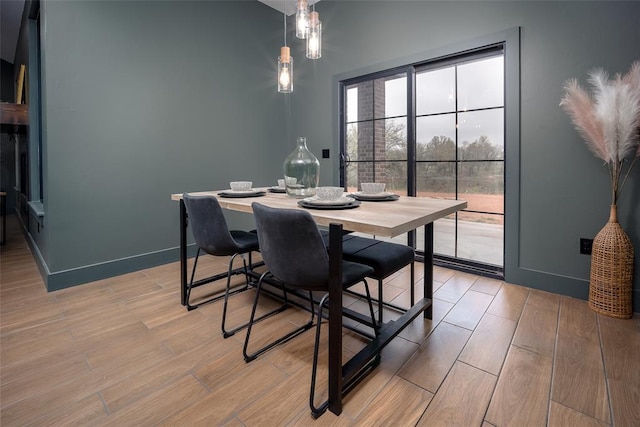 2040 County Road 1336, Blanchard, OK 73010 - dining room featuring baseboards and light wood finished floors