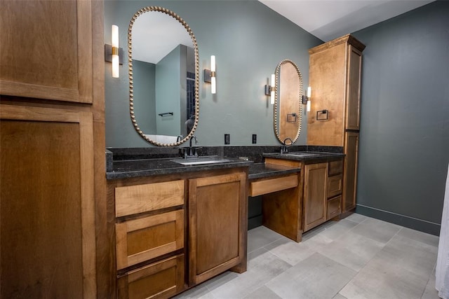 2040 County Road 1336, Blanchard, OK 73010 - bathroom with double vanity, a sink, and baseboards